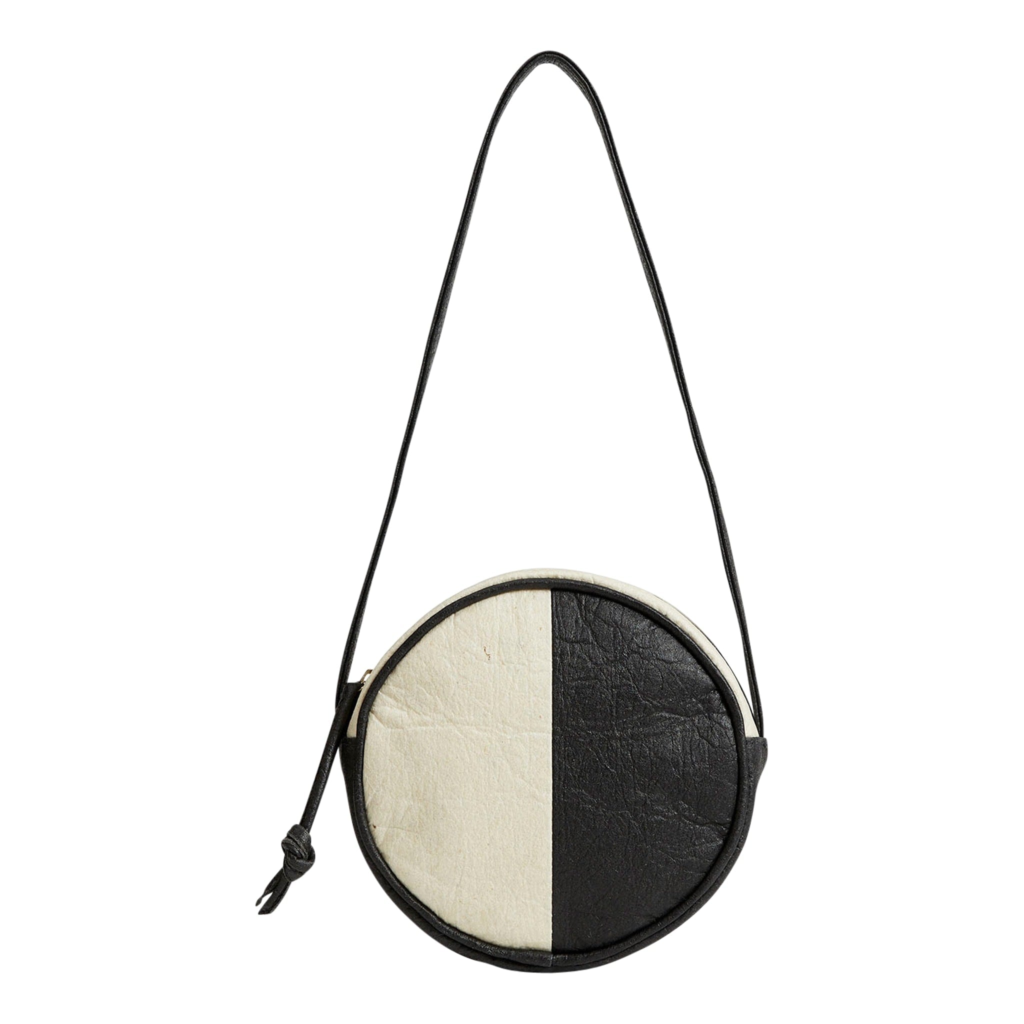 Pineapple leather two-toned black and white circle shoulder bag.