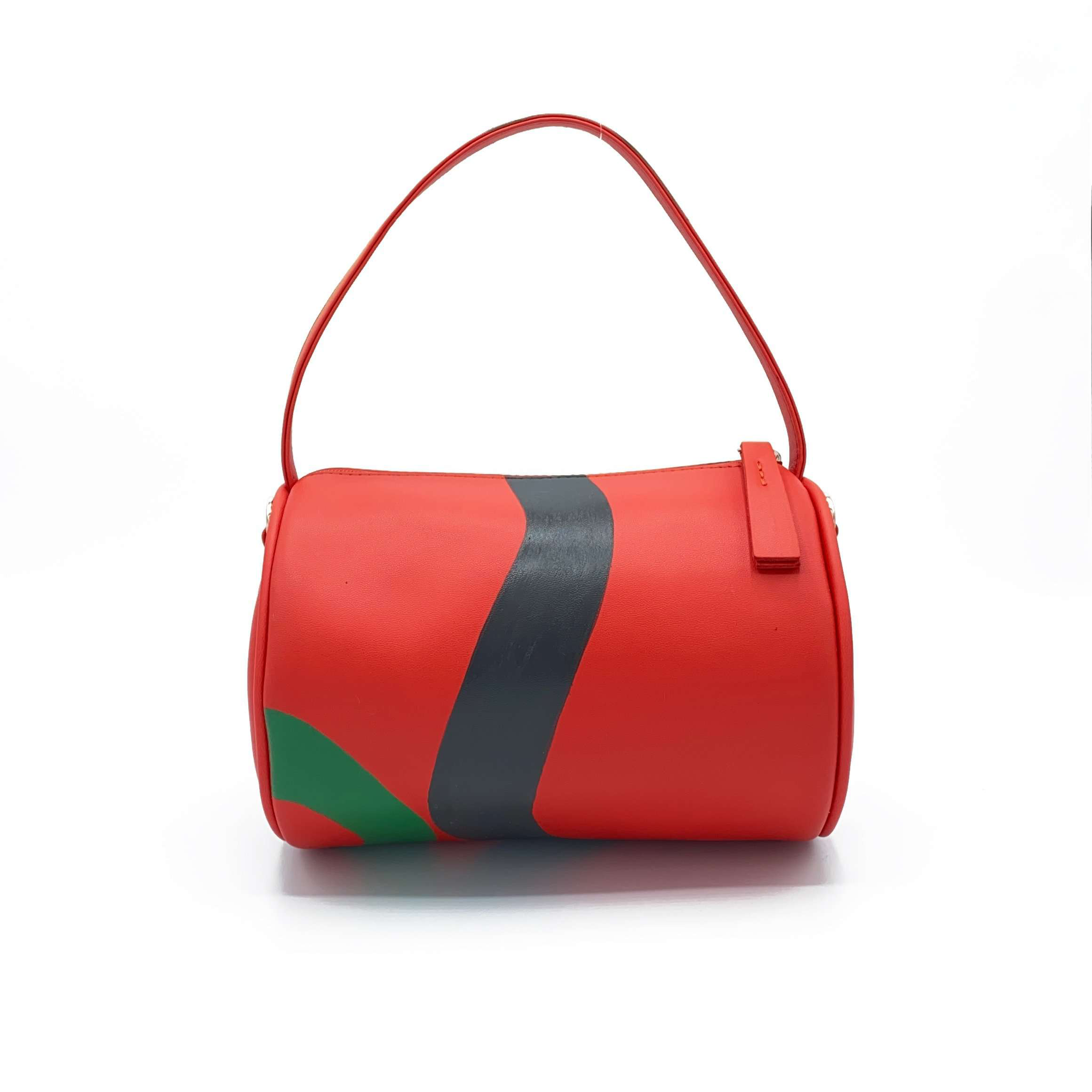 Vegan leather duffle style mini bag with detachable crossbody strap in red with hand painted squiggles in black and green.   Side A.